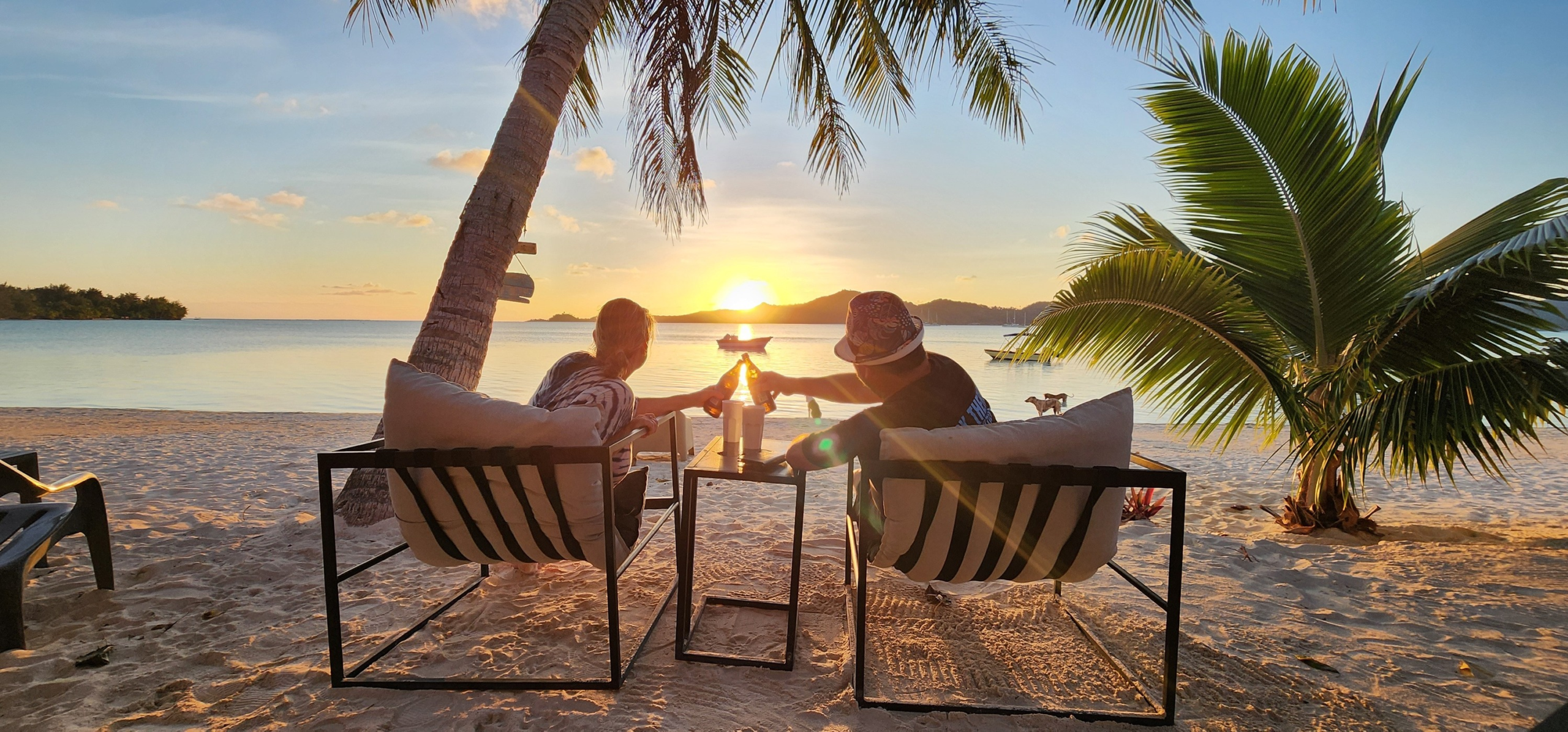 Mike Cameron and his wife Sophie enjoying a stunning sunset in Bora Bora, capturing the freedom and lifestyle behind the Travel Like Mike brand